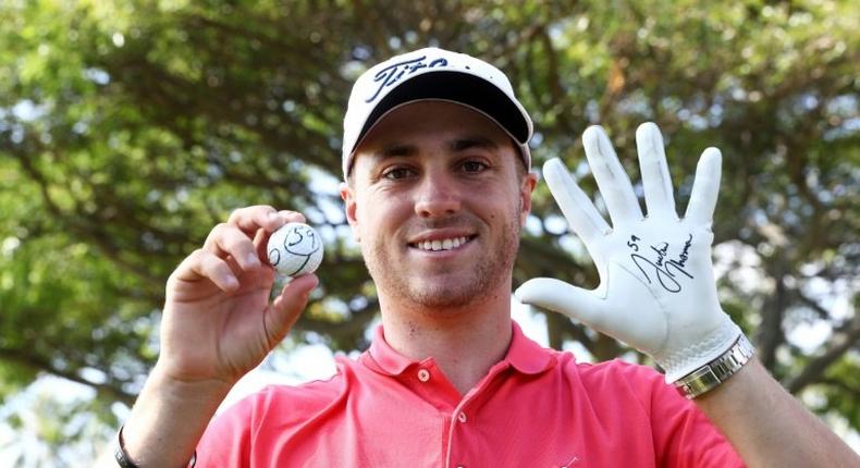 Justin Thomas of the United States celebrates after scoring a 59 during the first round of the Sony Open In Hawaii at Waialae Country Club on January 12, 2017 in Honolulu, Hawaii