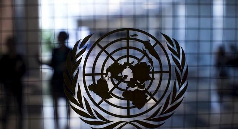 A United Nations logo is seen on a glass door in the Assembly Building at the United Nations headquarters in New York City September 18, 2015. REUTERS/Mike Segar