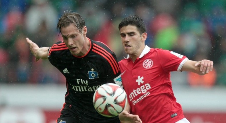 Mainz (red) and Hamburg (black), pictured in 2015, are both left on 34 points after Sunday's goalless draw, with Hamburg in the relegation play-off place due to their inferior goal difference