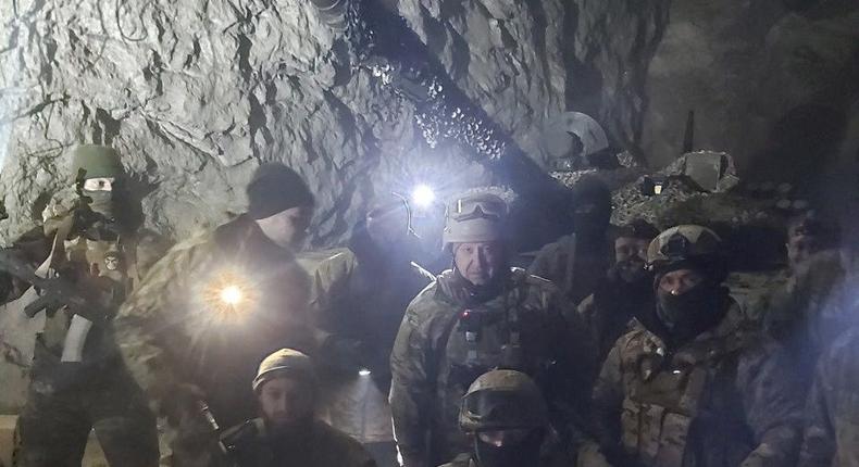 People in military uniform, claimed to be soldiers of Russian mercenary group Wagner and its head Yevgeny Prigozhin, pose for a picture believed to be in a salt mine in Soledar in the Donetsk region, Ukraine, in this picture released January 10, 2023.Reuters