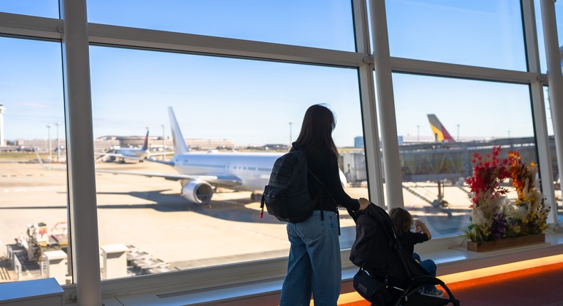 The author (not pictured) needed the help of another mom to board the plane.rudi_suardi/Getty Images