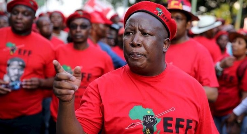 Leader of South Africa's left-wing Economic Freedom Fighters (EFF) Julius Malema gestures after arriving at the Johannesburg Stock Exchange (JSE) in Sandton, October 27, 2015. REUTERS/Siphiwe Sibeko