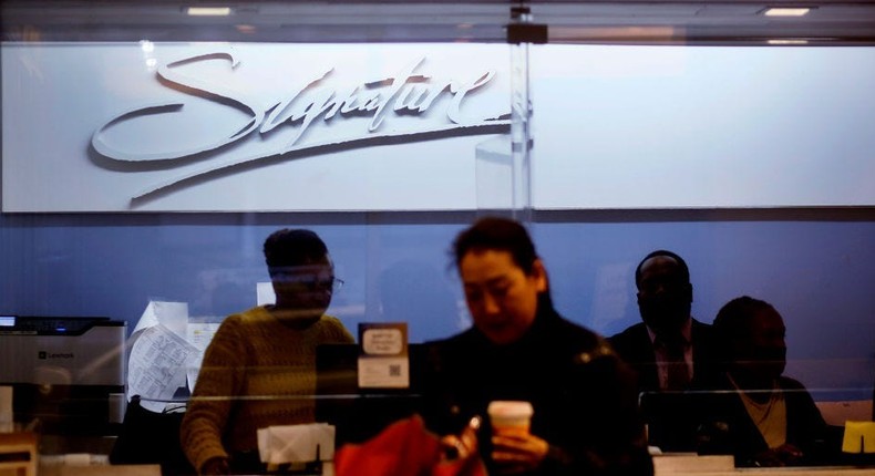 A woman visits the Signature Bank branch in New York City. Signature Bank was closed by regulators.Leonardo Munoz/VIEWpress