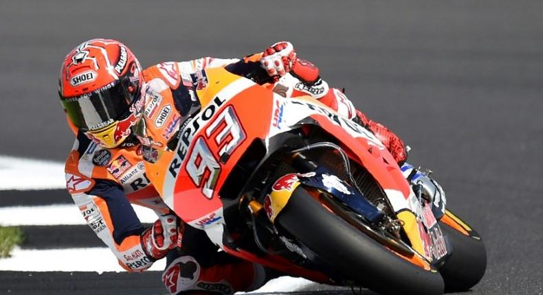 Rider Marc Marquez exits Luffield Corner during the fourth free practice session of the British Grand Prix weekend in Northamptonshire, southern England, on August 26