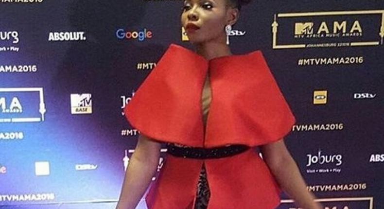 Yemi Alade performed in a red cape top paired with sequin bum shorts