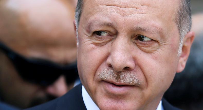 FILE PHOTO: Turkey's President Recep Tayyip Erdogan pays his respects at a convoy carrying remains of the Srebrenica genocide victims, in Sarajevo, Bosnia and Herzegovina, July 9, 2019. REUTERS/Dado Ruvic/File Photo