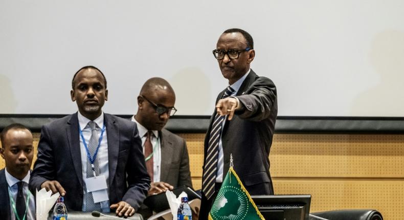 African Union chairperson and Rwanda's President Paul Kagame (R) gestures at the beginning of an African Union High Level Consultation Meeting with African leaders regarding the DR Congo election