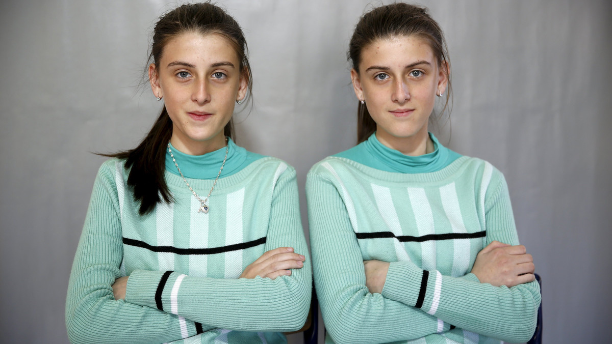 Twins Almedina and Ajla Djulic pose for a portrait in a primary school in Buzim