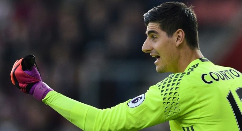 Chelsea's goalkeeper Thibaut Courtois sets his wall to defend a free kick on October 30, 2016