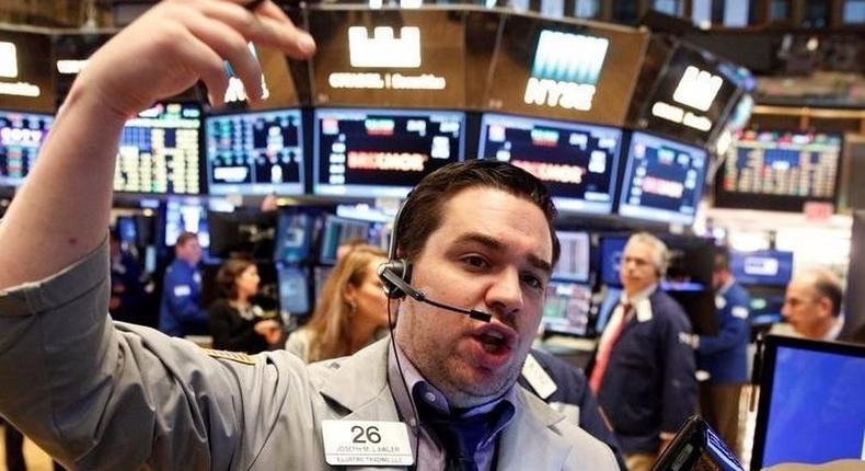 Traders work on the floor of the NYSE