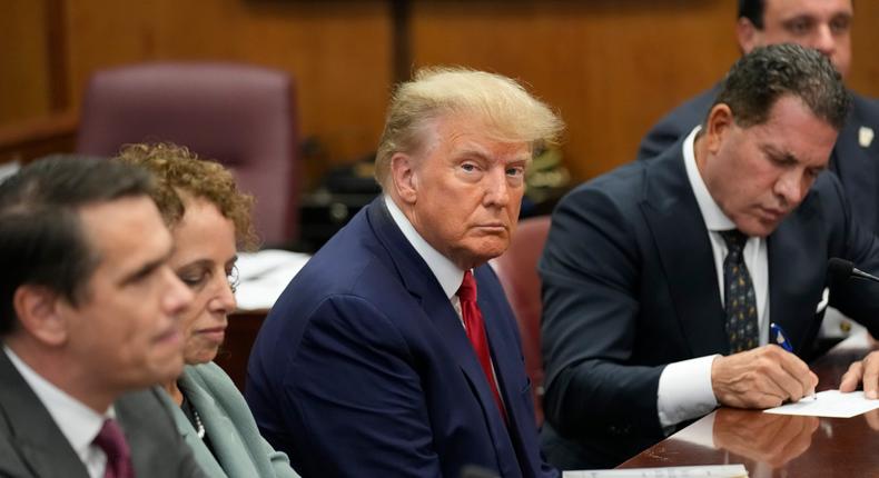 Former President Donald Trump sits at the defense table with his defense team in a Manhattan court, Tuesday, April 4, 2023.AP Photo/Seth Wenig, Pool