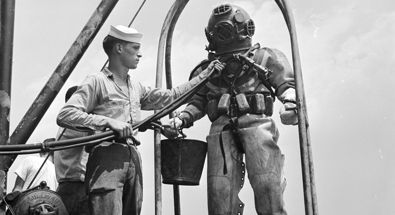 A US navy diver on a diving stage before a dive in 1955.Al Barry/Three Lions/Getty