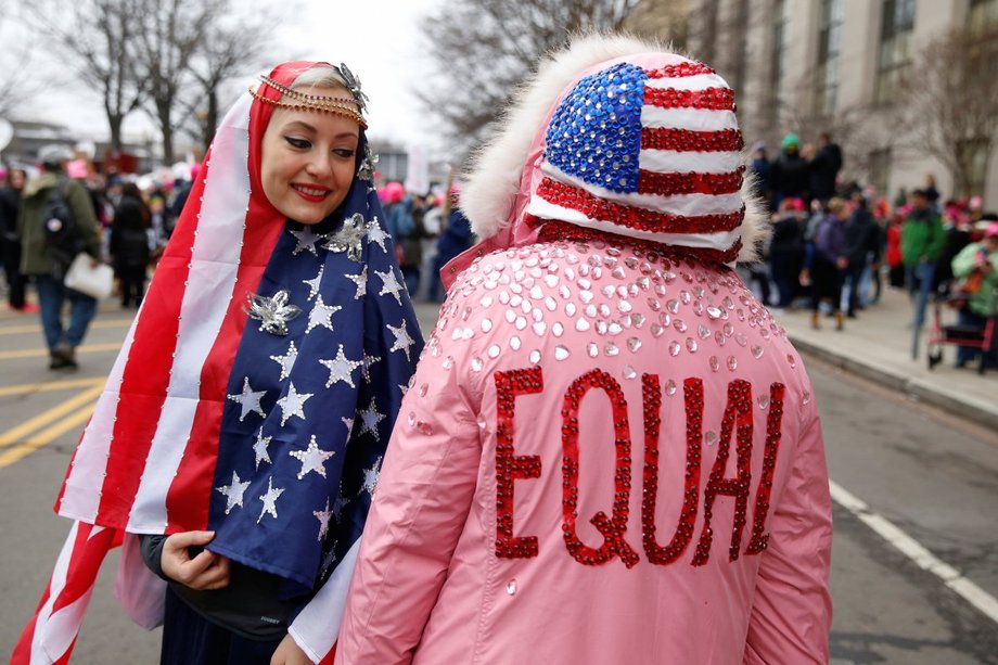 Gizelle Begler and Mira Veikley pose for a photograph at the Women's March in Washington.