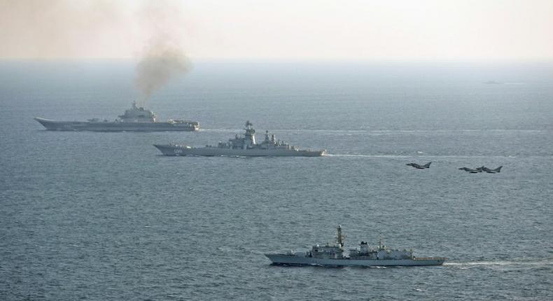 In a picture released by the British Ministry of Defence, UK ships and aircraft shadow the Russian Petr Velikiy (C) and the Russian Admiral Kuznetsov (top) as they pass through the English Channel January 24, 2017