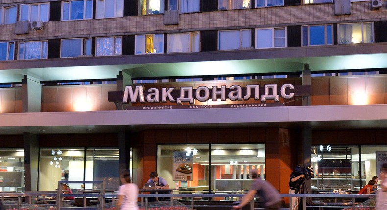 People walk past a closed McDonald's restaurant in Moscow, August 20, 2014.