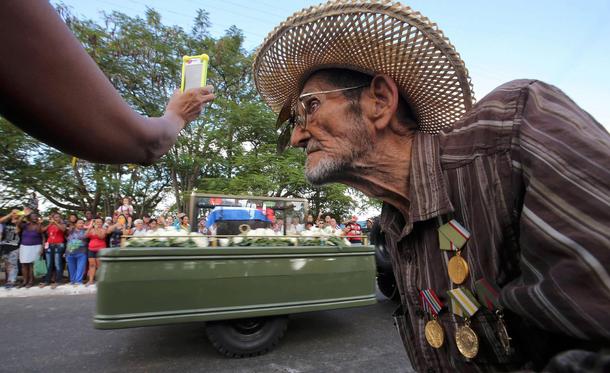 Guillermo Enrique Cadiz, 82, who fought with Fidel Castro in the Sierra Maestra, watches as Castro's