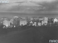Panorama Gdyni. Widoczny budynek motelu, szyld maszyn do szycia Singer i czekolady Wedel. Rok 1930