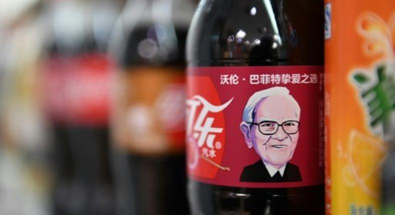 A cartoon likeness of US billionaire Warren Buffett adorns Cherry Coke bottles in a Beijing convenience store