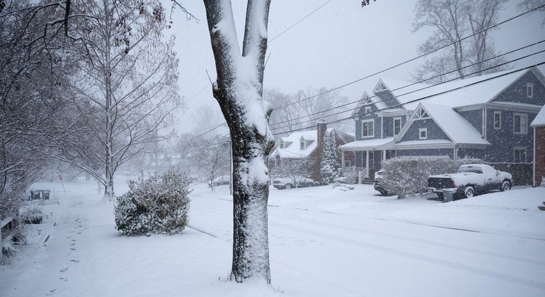 A street is covered in snow in Bethesda, Maryland on January 3, 2022. - A winter storm is bringing heavy snow to Washington, DC and the mid-Atlantic region on Monday.