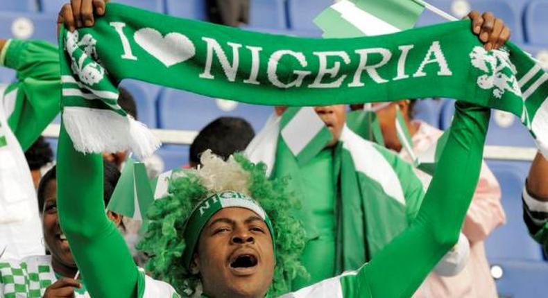 An illustrative photo of a Nigerian football fan cheering the Super Eagles