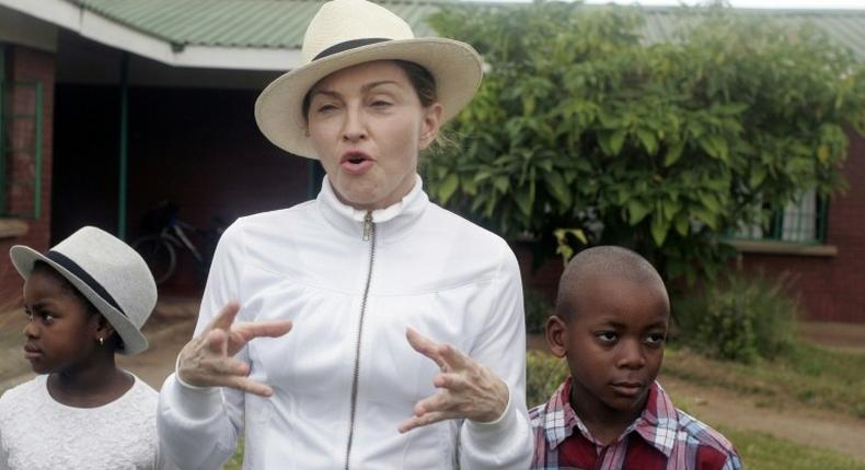 US pop superstar Madonna adopted Malawian children David Banda (R) in 2006 and Mercy James in 2009