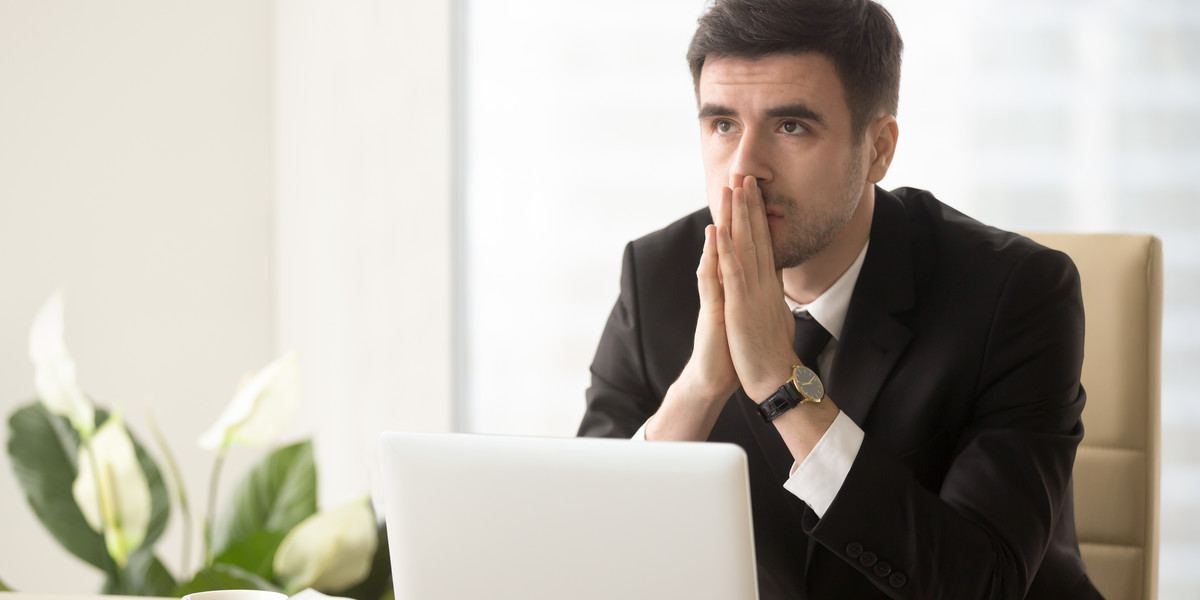 Pensive entrepreneur pondering serious problem