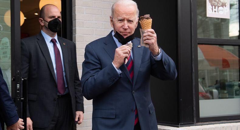 US President Joe Biden carries an ice cream cone as he leaves Jeni's Ice Cream in Washington, DC, on January 25, 2022.SAUL LOEB/AFP via Getty Images