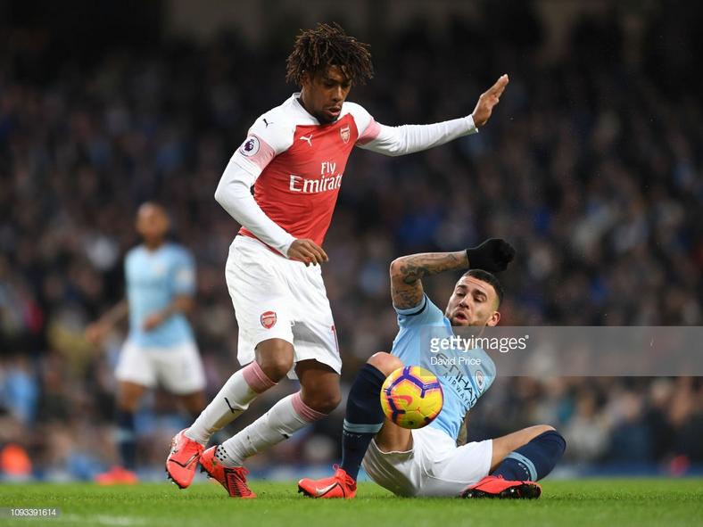 Alex Iwobi and Nicolás Otamendi 