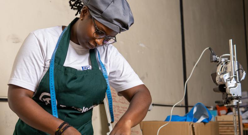 A youth sewing (Photo credit: Innovation Village)