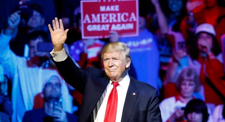 Republican presidential candidate Donald Trump waves to the crowd during a campaign rally at the US Bank Arena on October 13, 2016 in Cincinnati, Ohio