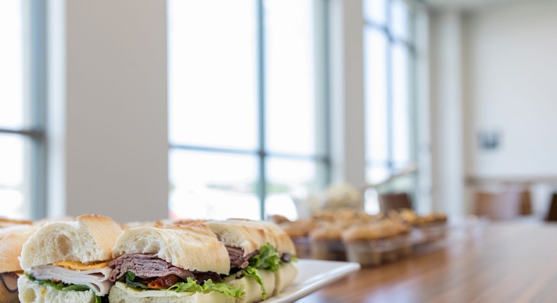 A stock photo shows leftover sandwiches in a meeting room.SDI Productions/Getty Images