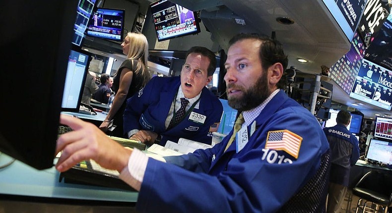 Traders work on the floor of the New York Stock Exchange.
