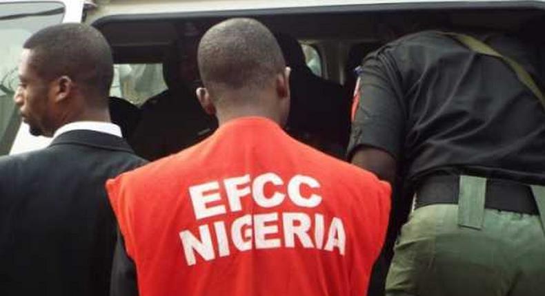 An EFCC officer during a raid