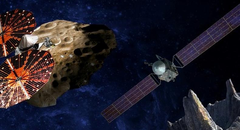 NASA artist drawing of the Lucy spacecraft (L) which will study Jupiter's so-called Trojan asteroids, thought to be relics of a much earlier era in the solar system