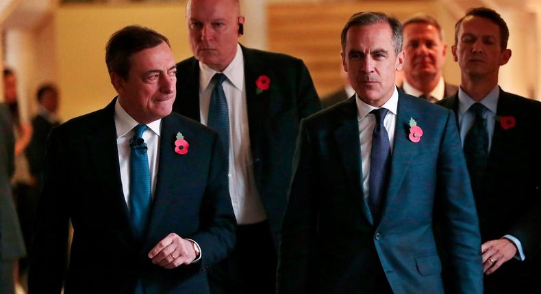 Mario Draghi, the European Central Bank president, with Mark Carney, the Bank of England governor, at the Bank of England's Open Forum 2015 conference on financial regulation in London.