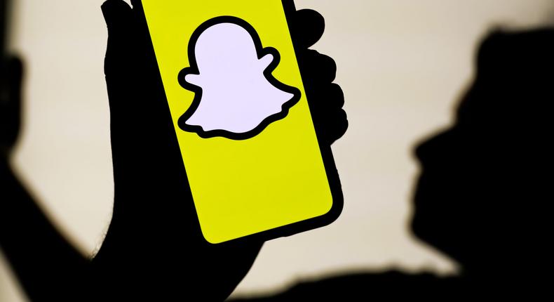 The Snapchat logo shown on a smartphone.