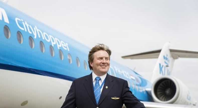 Dutch King Willem-Alexander posing in front of a KLM Cityhopper aircraft at Schiphol Airport, near Amsterdam on May 16, 2017