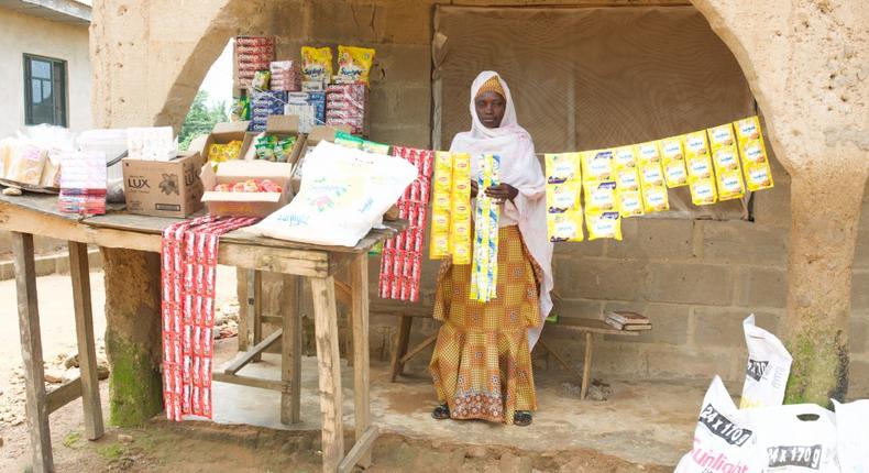 Image: A beneficiary of the Unilever Shakti program and her Merchandise.