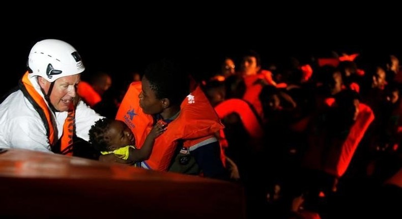 Migrants are seen during rescue operation in the Mediterranea Sea October 20, 2016. 