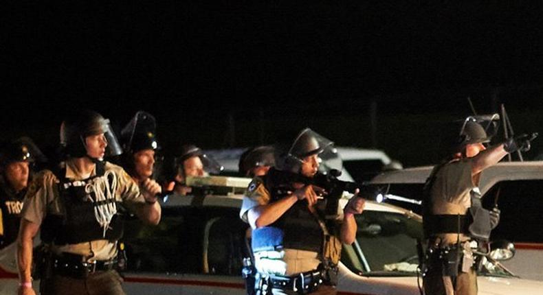 Gunshots heard as Ferguson protests turn violent a year after Brown shooting