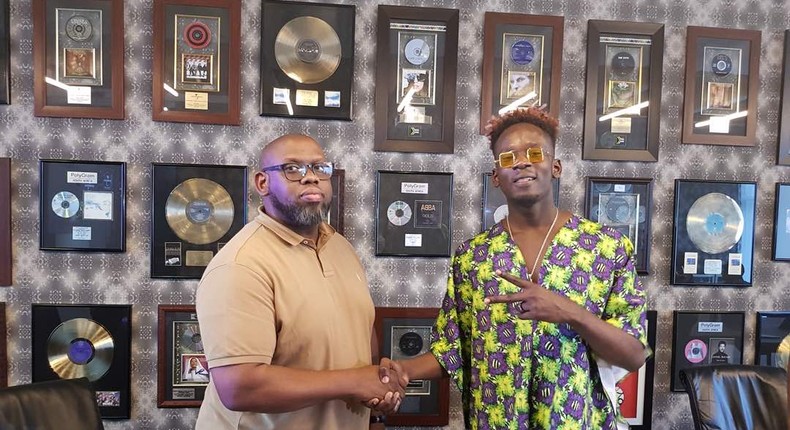 Mr Eazi and head of Universal Africa, Sipho Dlamini sign a licensing deal in South Africa