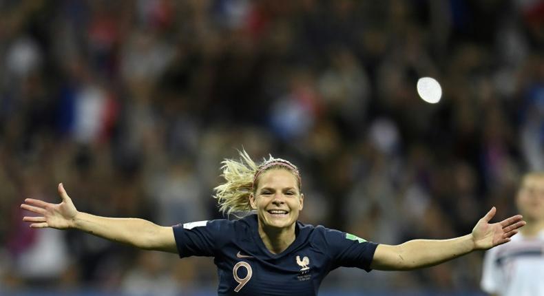 Eugenie Le Sommer celebrates her decisive penalty for France