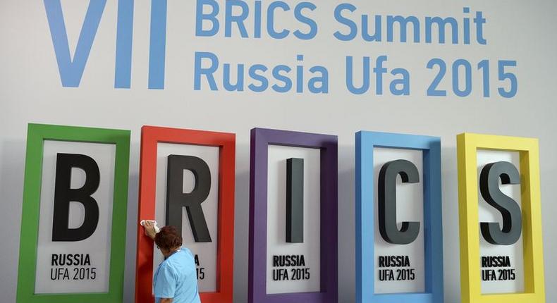 An employee cleans a board during the preparations for the BRICS summit in Ufa, Russia, July 7, 2015. REUTERS/BRICS Photohost/RIA Novosti