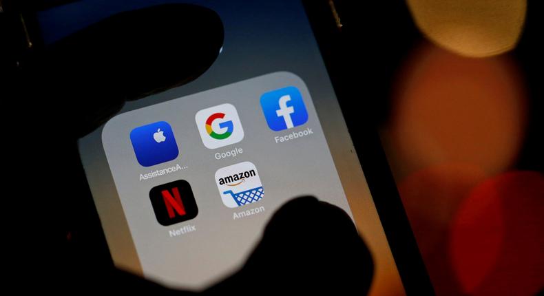 FILE PHOTO: The logos of mobile apps, Google, Amazon, Facebook, Apple and Netflix, are displayed on a screen in this illustration picture taken December 3, 2019. REUTERS/Regis Duvignau/File Photo