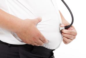 fat Man holding stethoscope for medical exam concept