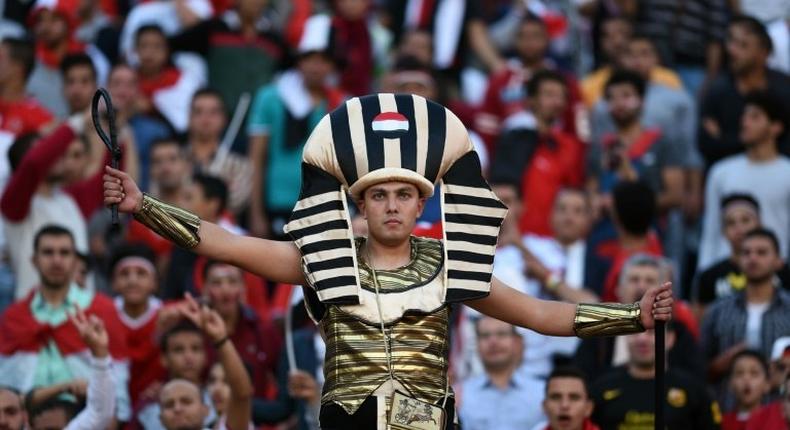 Egyptian fans cheer at the Borg el-Arab Stadium near Alexandria, on November 13, 2016