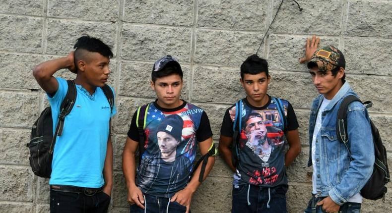 Hondurans bound for the US gather outside a bus station in San Pedro Sula, north of the capital Tegucigalpa