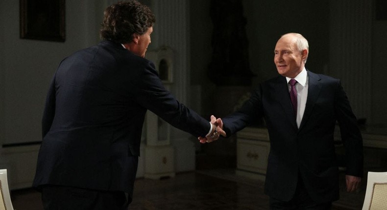 Russia's President Vladimir Putin gives an interview to former Fox News host Tucker Carlson at the Kremlin in Moscow on February 6, 2024.GAVRIIL GRIGOROV