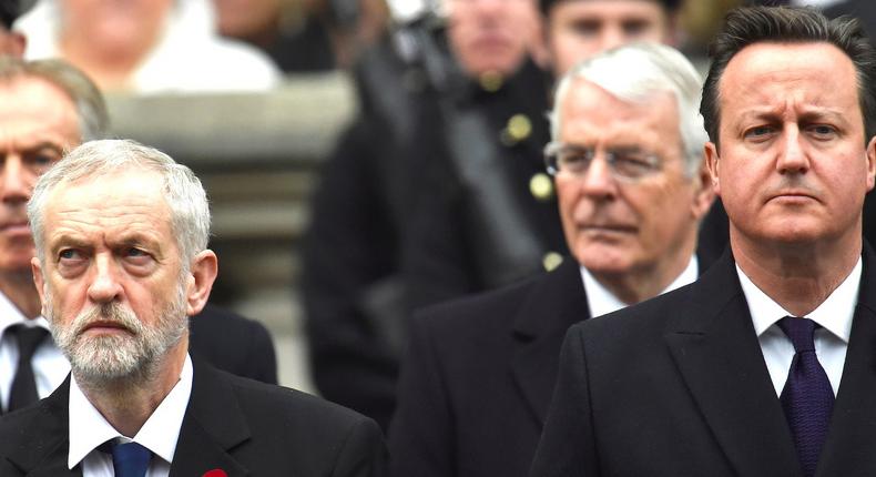 Former Prime Minister Tony Blair (L) stands behind Jeremy Corbyn, the leader of Britain's opposition Labour Party, as Prime Minister David Cameron stands in front of former Prime Minister John Major at the Remembrance Sunday ceremony at the Cenotaph in central London, November 8, 2015.