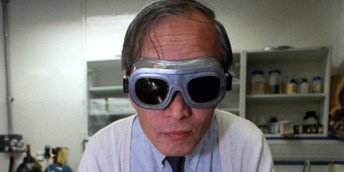 Professor Hiroyuki Hiraoko poses with his university experiment which is used to make diamonds from plastic in Hong Kong.